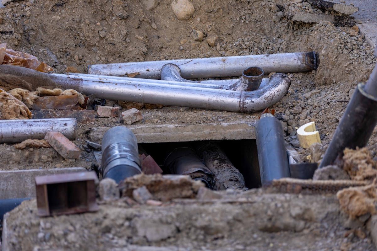 Septic system installation — pipes laid in excavated trench
