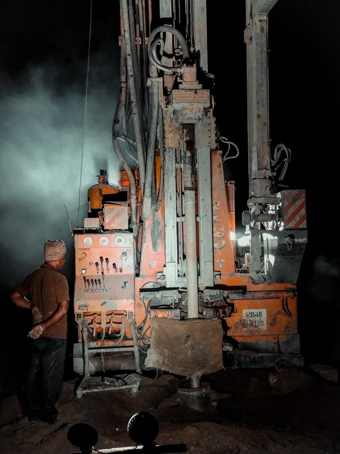 Water well drilling rig in operation
